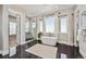 Serene bathroom with a freestanding tub, walk-in shower, and a large window for natural light at 12450 Watkins Rd, Hudson, CO 80642
