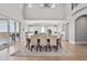 Bright dining area connecting to a modern kitchen, with beautiful backyard views at 12450 Watkins Rd, Hudson, CO 80642