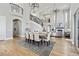 Open dining room featuring high ceilings, a modern staircase, and backyard access at 12450 Watkins Rd, Hudson, CO 80642