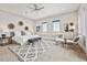 Expansive main bedroom suite with neutral decor, decorative rug, and many windows providing natural light at 12450 Watkins Rd, Hudson, CO 80642