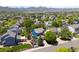 Scenic aerial view of a residential neighborhood with lush trees and mountain backdrop at 9569 Elk Mountain Cir, Littleton, CO 80125