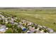 An aerial view showcasing the neighborhood, and rolling hills beyond at 9569 Elk Mountain Cir, Littleton, CO 80125