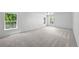 Large bedroom with three windows providing ample natural light at 9569 Elk Mountain Cir, Littleton, CO 80125