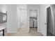 Bright hallway with views to laundry room, half bath and living room at 9569 Elk Mountain Cir, Littleton, CO 80125