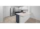 Modern kitchen features stainless steel appliances, white subway tile, and granite countertops at 9569 Elk Mountain Cir, Littleton, CO 80125