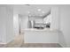 Modern kitchen with white cabinets, stainless steel appliances, and granite countertops at 9569 Elk Mountain Cir, Littleton, CO 80125