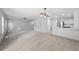 Inviting living space features hardwood floors and seamlessly connects kitchen and living areas at 9569 Elk Mountain Cir, Littleton, CO 80125