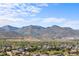 Scenic neighborhood with mountain views and a serene lake at 9569 Elk Mountain Cir, Littleton, CO 80125