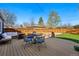 Inviting deck with outdoor seating, dining area, grill and lawn at 1390 S Glencoe St, Denver, CO 80222