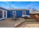 Spacious deck perfect for outdoor dining and relaxation, attached to a charming blue home at 1390 S Glencoe St, Denver, CO 80222