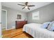 Bedroom featuring hardwood floors, neutral wall color, and plenty of natural light at 1390 S Glencoe St, Denver, CO 80222