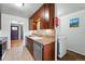 Updated kitchen featuring modern appliances and a view into the open living area at 1390 S Glencoe St, Denver, CO 80222