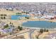 This aerial view features community amenities, ponds, parks, and picturesque suburban scenery at 17808 E 104Th Pl # C, Commerce City, CO 80022