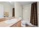 Bathroom featuring a shower and tub combination with a single sink vanity at 17808 E 104Th Pl # C, Commerce City, CO 80022