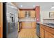 Bright kitchen features stainless steel appliances, light wood cabinets and granite countertops at 17808 E 104Th Pl # C, Commerce City, CO 80022