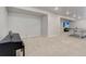 A finished basement with neutral carpet, a ping pong table, and a piano offers versatile living space at 14290 Hop Clover St, Parker, CO 80134