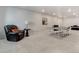 Finished basement featuring a cozy chair, table lamp, and ping pong table at 14290 Hop Clover St, Parker, CO 80134