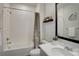 Bright bathroom with white subway tile, neutral-toned shower curtain, and modern vanity mirror at 14290 Hop Clover St, Parker, CO 80134