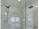 Bathroom showcasing a glass shower and elegant marble tile at 14290 Hop Clover St, Parker, CO 80134