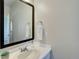 Bathroom with a large mirror, a modern vanity and a white towel at 14290 Hop Clover St, Parker, CO 80134