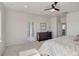 This well-lit bedroom boasts an ensuite bathroom, walk-in shower, and dresser at 14290 Hop Clover St, Parker, CO 80134
