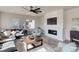 Inviting living room with a cozy fireplace, modern decor, and comfortable seating at 14290 Hop Clover St, Parker, CO 80134