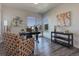 This home office features large windows, modern decor, and comfortable seating, creating an inviting workspace at 14290 Hop Clover St, Parker, CO 80134