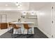 Stylish basement bar area with counter seating and floating shelves at 3147 Juniper Ct, Golden, CO 80401