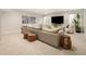 Basement living room with a large sectional sofa and modern decor at 3147 Juniper Ct, Golden, CO 80401