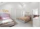 Spacious bedroom features two beds and a walk-in closet with lots of natural light at 3147 Juniper Ct, Golden, CO 80401