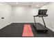 Home gym area with a treadmill and exercise mat on a rubber floor at 3147 Juniper Ct, Golden, CO 80401