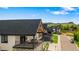 Beautiful two-story home with a black roof, stone accents, and a large second-story balcony, with mountain views at 3147 Juniper Ct, Golden, CO 80401