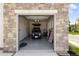 Spacious garage with epoxy flooring, featuring a golf cart and ample storage at 3147 Juniper Ct, Golden, CO 80401