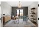 Elegant home office featuring a modern desk, wainscoting detail, and ample natural light at 3147 Juniper Ct, Golden, CO 80401