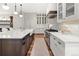 Gourmet kitchen with custom cabinets, stainless appliances, and quartz countertops at 3147 Juniper Ct, Golden, CO 80401