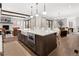 Spacious kitchen featuring a center island with white countertops, farmhouse sink, and modern stainless steel appliances at 3147 Juniper Ct, Golden, CO 80401