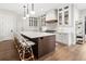 Gourmet kitchen with an oversized island, quartz countertops, and custom cabinets at 3147 Juniper Ct, Golden, CO 80401