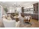 Spacious living area featuring hardwood floors, comfortable seating, and seamless access to the dining area at 3147 Juniper Ct, Golden, CO 80401