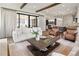Bright and airy living room with a cozy sofa, expansive windows, and a sliding glass door to the backyard at 3147 Juniper Ct, Golden, CO 80401
