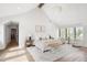 Bright, spacious main bedroom features high ceilings, a modern chandelier and a sitting area with lots of natural light at 3147 Juniper Ct, Golden, CO 80401