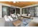 Inviting outdoor patio with stylish furniture, wood ceiling, and seamless indoor-outdoor transition at 3147 Juniper Ct, Golden, CO 80401