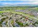 Stunning aerial view of the residential area, showcasing homes and green spaces with mountain views at 2833 Open Sky Way, Castle Rock, CO 80109