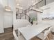 Spacious dining room featuring modern lighting, black metal railing, and open access to other living spaces at 2833 Open Sky Way, Castle Rock, CO 80109