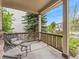 Inviting front porch with cozy seating and views of the neighborhood, perfect for relaxing outdoors at 2833 Open Sky Way, Castle Rock, CO 80109