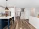 Modern kitchen featuring a center island with seating, stainless steel appliances, and easy access to the staircase at 2833 Open Sky Way, Castle Rock, CO 80109