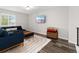 Upstairs living room boasts comfortable seating, a stylish rug, and plenty of space for relaxation at 2833 Open Sky Way, Castle Rock, CO 80109