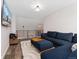 Cozy upstairs living room features a plush sectional, soft rug, and contemporary design elements at 2833 Open Sky Way, Castle Rock, CO 80109