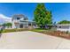 Exterior view of home with a large yard, garden area, and pergola covered patio at 606 Beth Ave, Fort Lupton, CO 80621