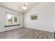 Bright dining area featuring wood-look floors, and a large window for ample natural light at 606 Beth Ave, Fort Lupton, CO 80621