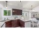 A bright dining area adjacent to the kitchen features laminate floors and neutral decor at 606 Beth Ave, Fort Lupton, CO 80621